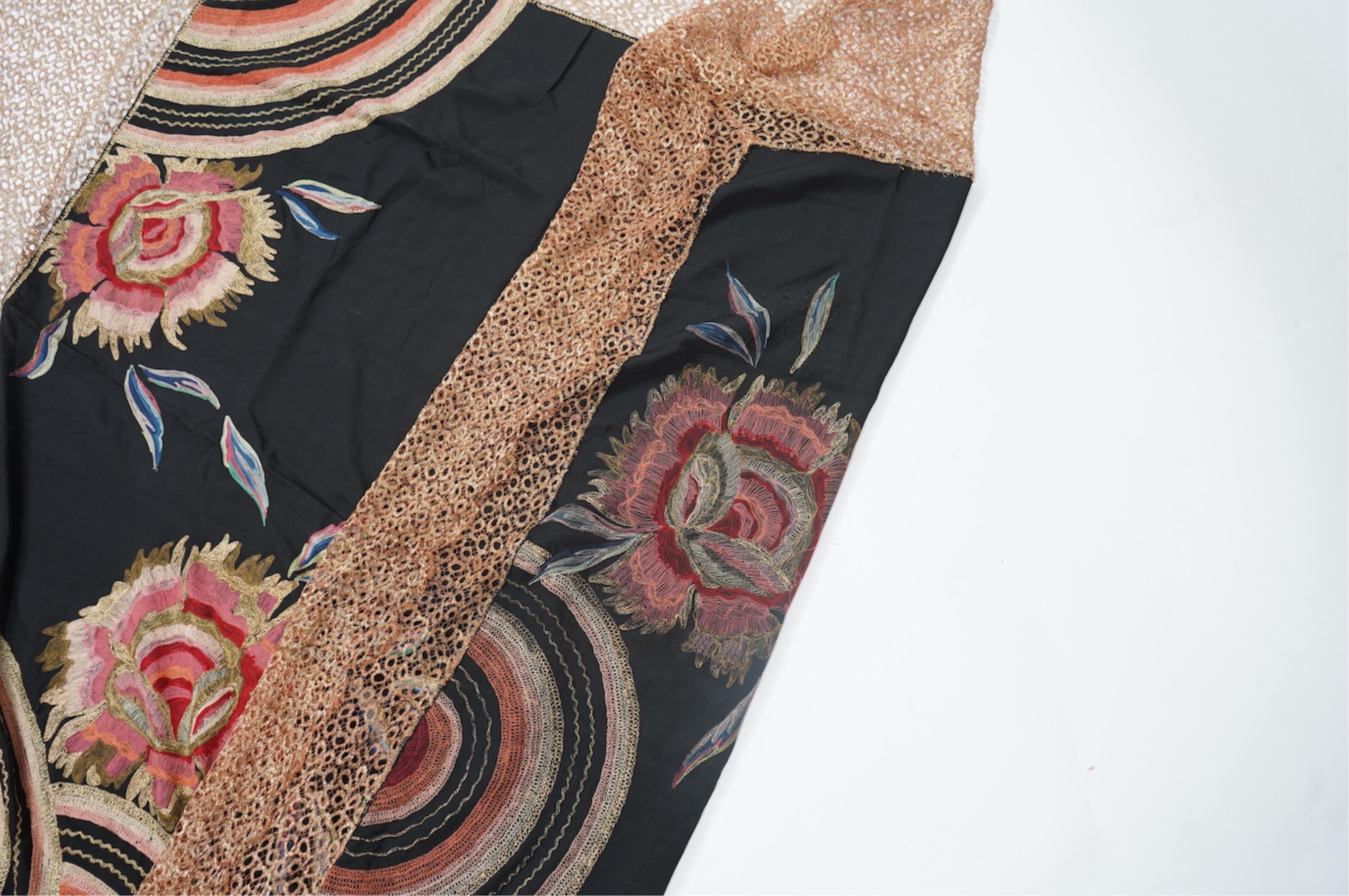 An Art Deco black silk floral embroidered shawl, using tones of red and orange with gold highlights, bordered with bronze metallic lace, together with a black crepe and yellow silk embroidered stole. Art Deco stole, 142c